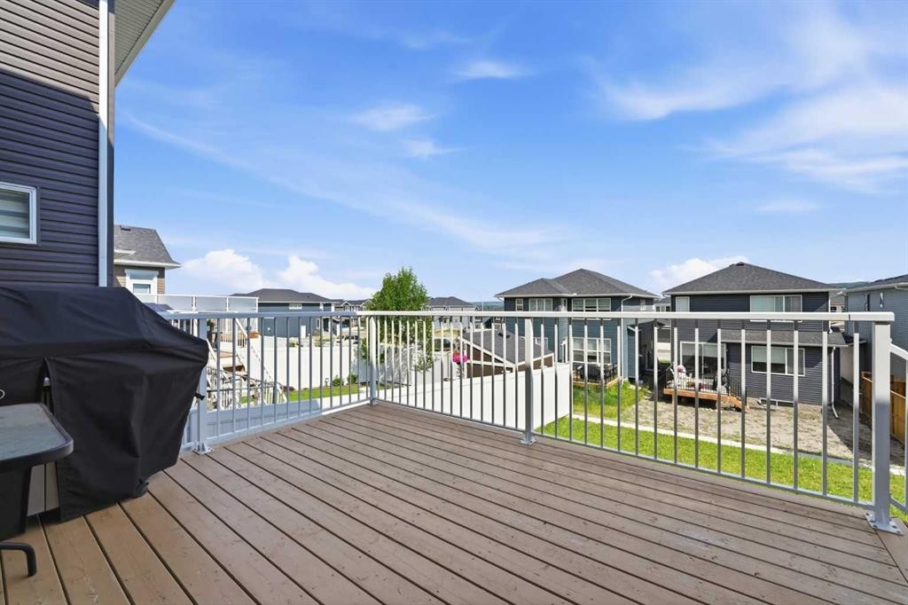 411 Rivercrest Boulevard, Cochrane, AB - Outdoor With Deck Patio Veranda With Exterior