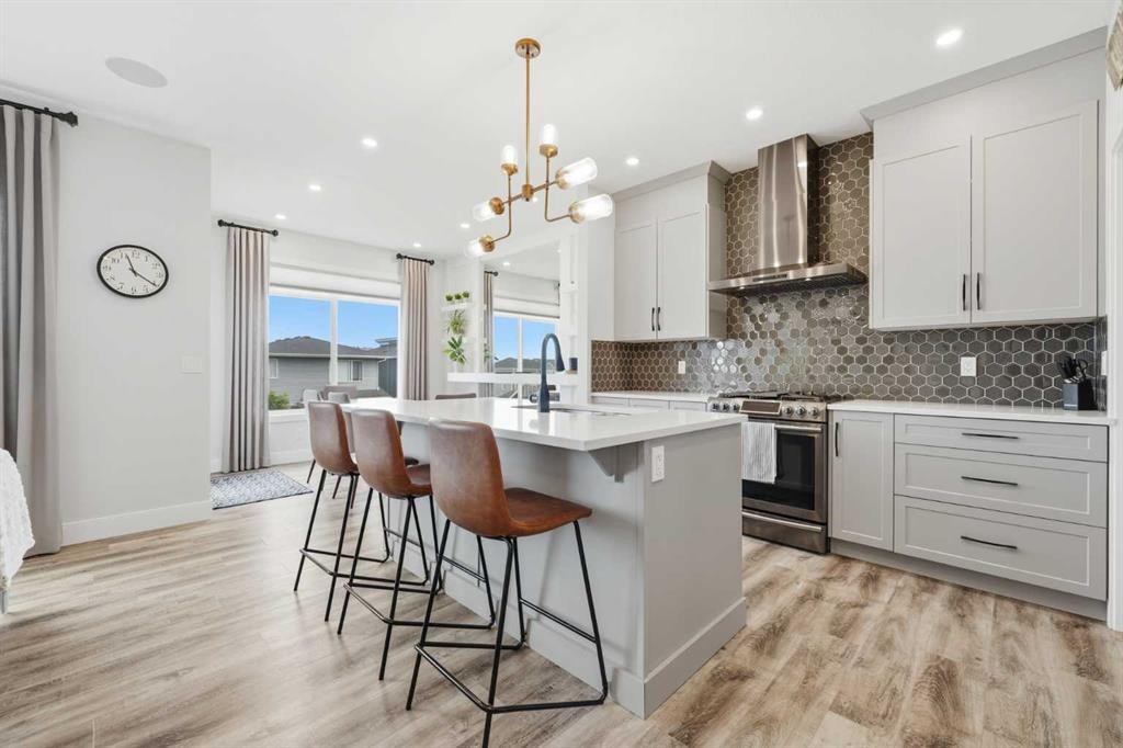 411 Rivercrest Boulevard, Cochrane, AB - Indoor Photo Showing Kitchen With Upgraded Kitchen