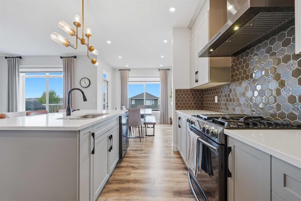 411 Rivercrest Boulevard, Cochrane, AB - Indoor Photo Showing Kitchen With Upgraded Kitchen