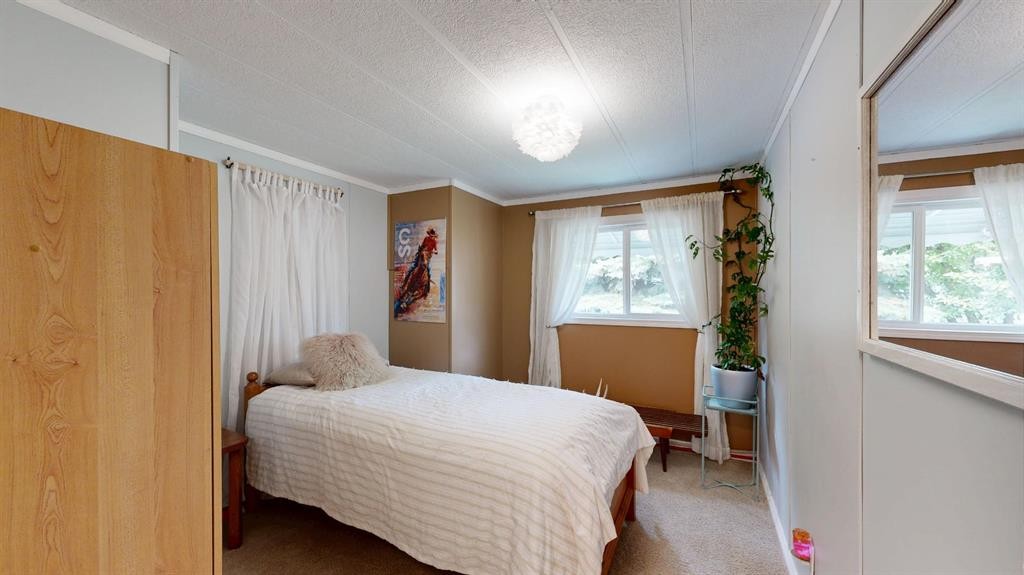 304 Slade Drive, Nanton, AB - Indoor Photo Showing Bedroom