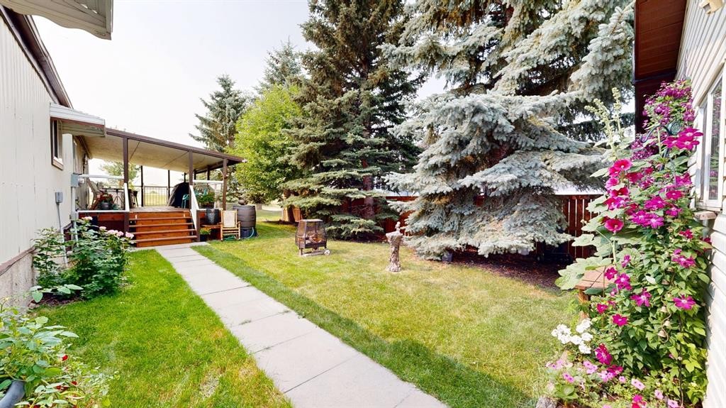 304 Slade Drive, Nanton, AB - Outdoor With Deck Patio Veranda