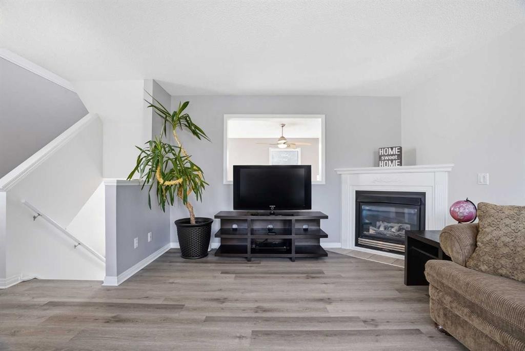 62 Country Hills Cove Nw, Calgary, AB - Indoor Photo Showing Living Room With Fireplace