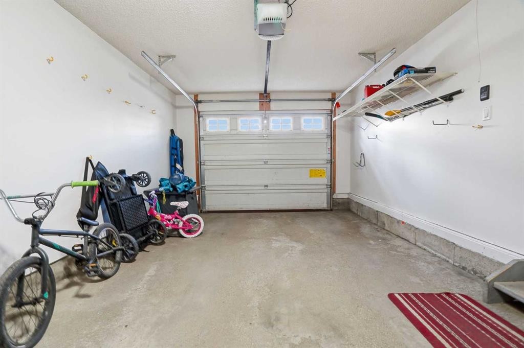 62 Country Hills Cove Nw, Calgary, AB - Indoor Photo Showing Garage