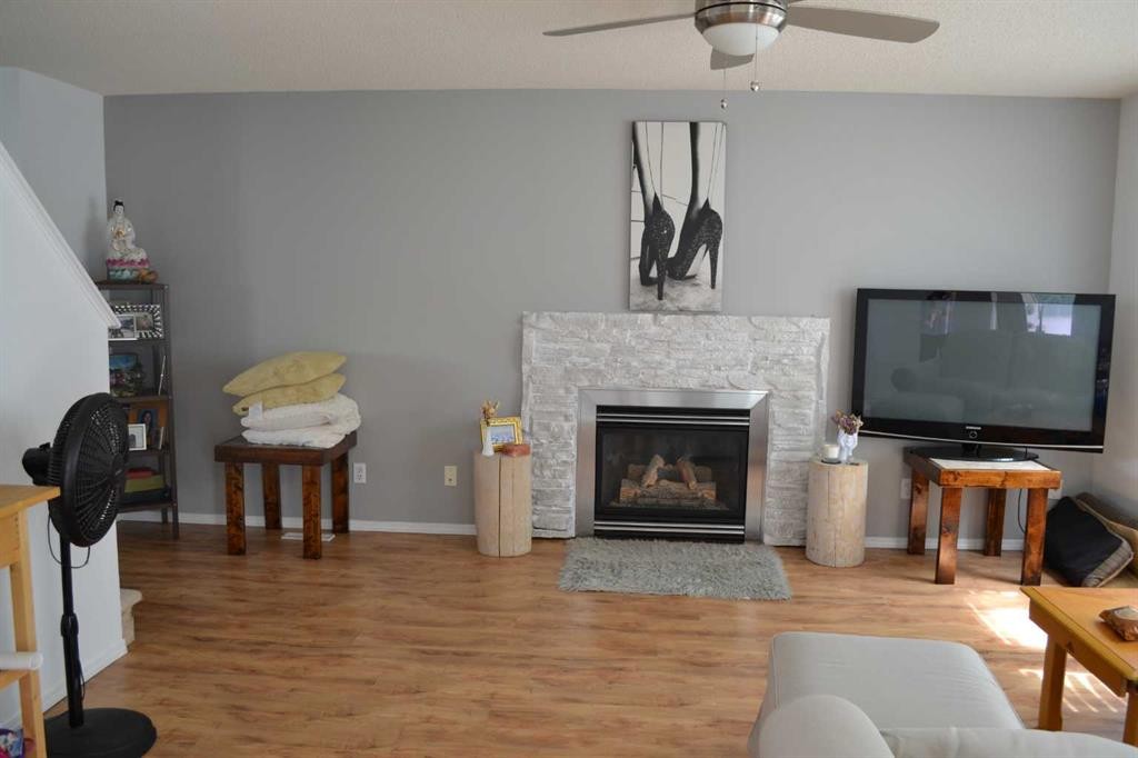 102 Citadel Mesa Close, Calgary, AB - Indoor Photo Showing Living Room With Fireplace
