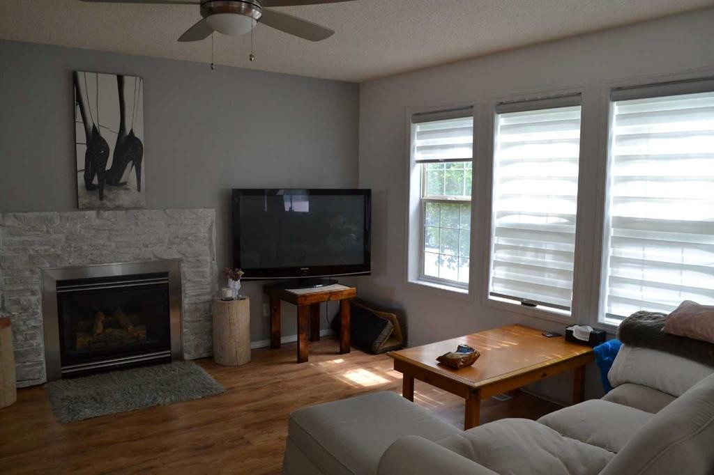 102 Citadel Mesa Close, Calgary, AB - Indoor Photo Showing Living Room With Fireplace
