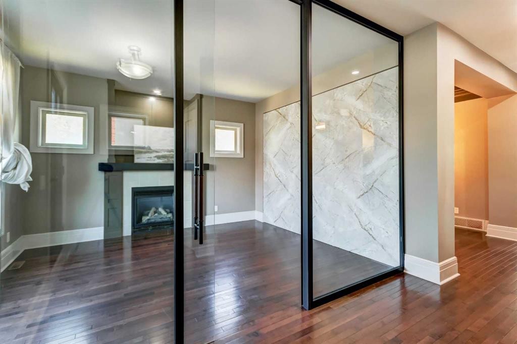 51 Aspen Meadows Green Sw, Calgary, AB - Indoor Photo Showing Other Room With Fireplace