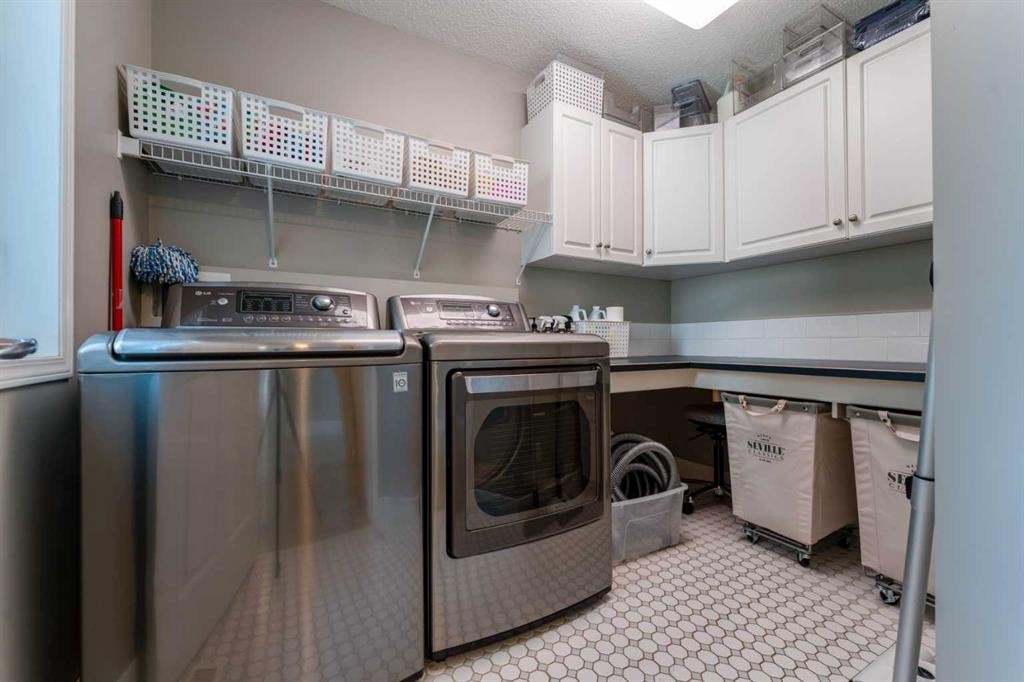 99 Springbluff Boulevard Sw, Calgary, AB - Indoor Photo Showing Laundry Room