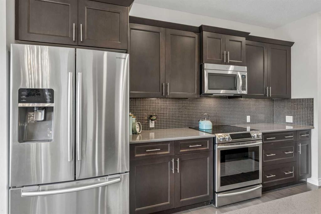11 Legacy Crescent Se, Calgary, AB - Indoor Photo Showing Kitchen With Stainless Steel Kitchen With Upgraded Kitchen