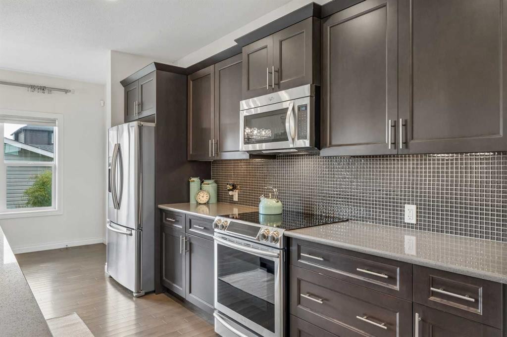11 Legacy Crescent Se, Calgary, AB - Indoor Photo Showing Kitchen With Stainless Steel Kitchen With Upgraded Kitchen