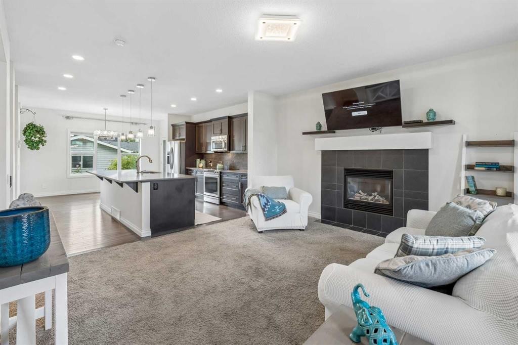 11 Legacy Crescent Se, Calgary, AB - Indoor Photo Showing Living Room With Fireplace