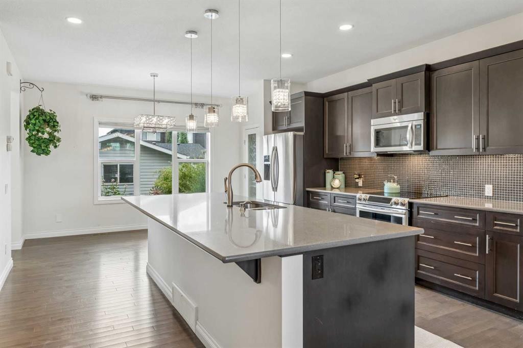 11 Legacy Crescent Se, Calgary, AB - Indoor Photo Showing Kitchen With Stainless Steel Kitchen With Upgraded Kitchen