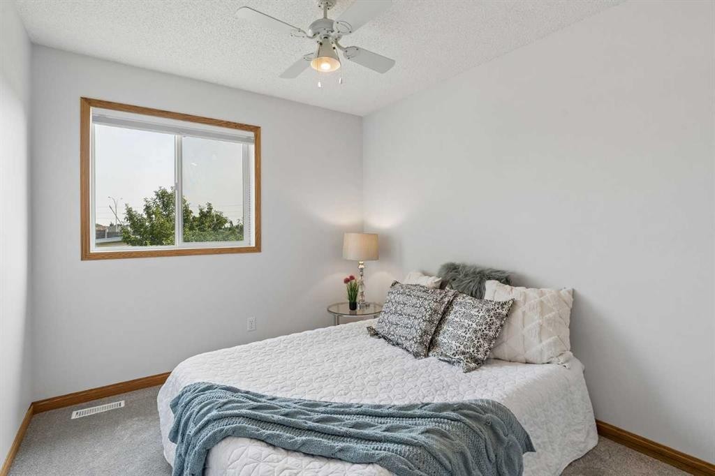 246 Mt Lorette Place Se, Calgary, AB - Indoor Photo Showing Bedroom