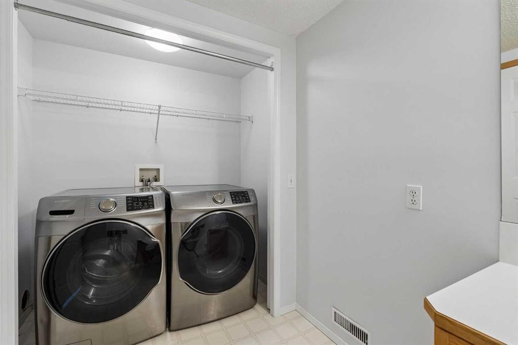 246 Mt Lorette Place Se, Calgary, AB - Indoor Photo Showing Laundry Room
