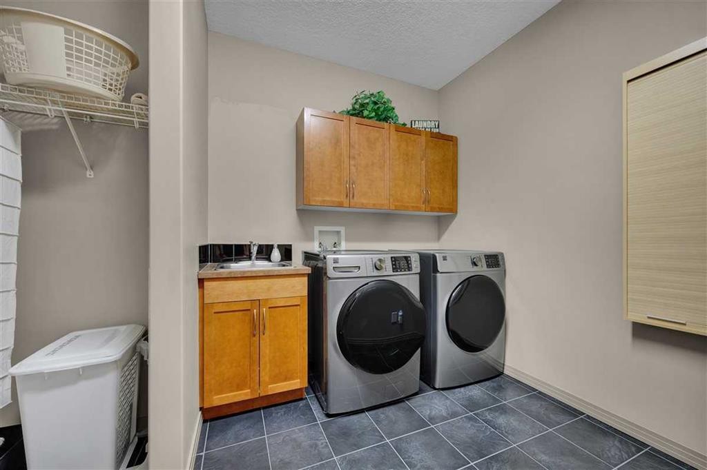 146 Springborough Point Sw, Calgary, AB - Indoor Photo Showing Laundry Room