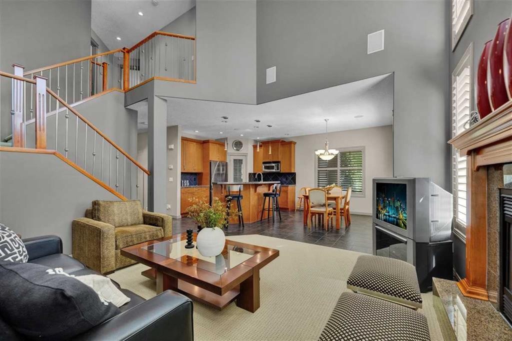 146 Springborough Point Sw, Calgary, AB - Indoor Photo Showing Living Room With Fireplace