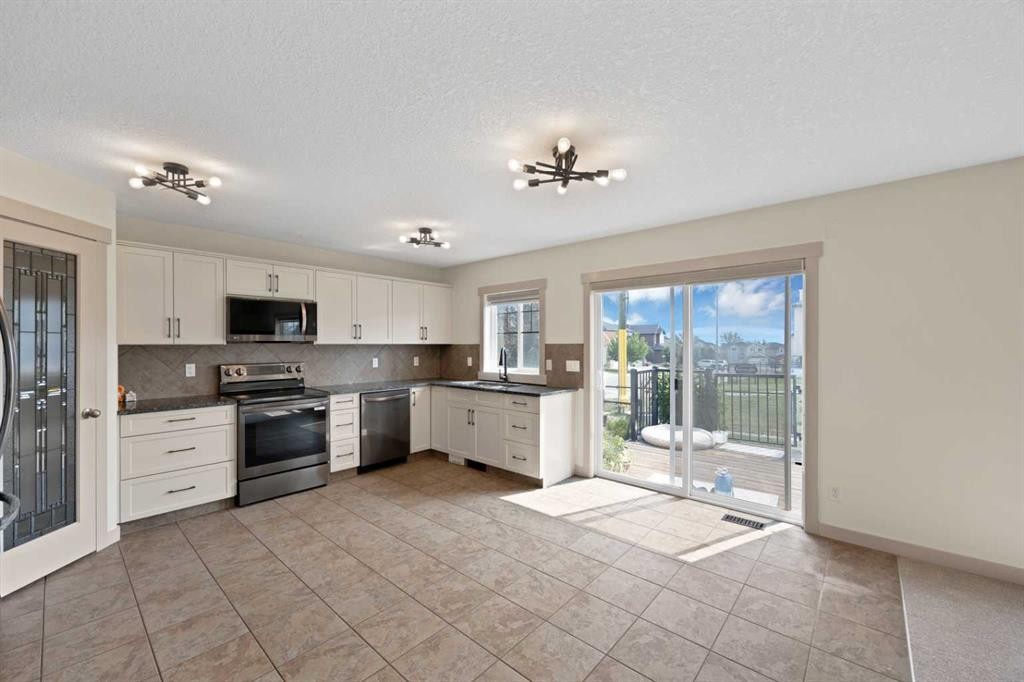 130 Panamount Road Nw, Calgary, AB - Indoor Photo Showing Kitchen With Stainless Steel Kitchen