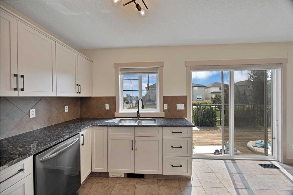 130 Panamount Road Nw, Calgary, AB - Indoor Photo Showing Kitchen With Double Sink