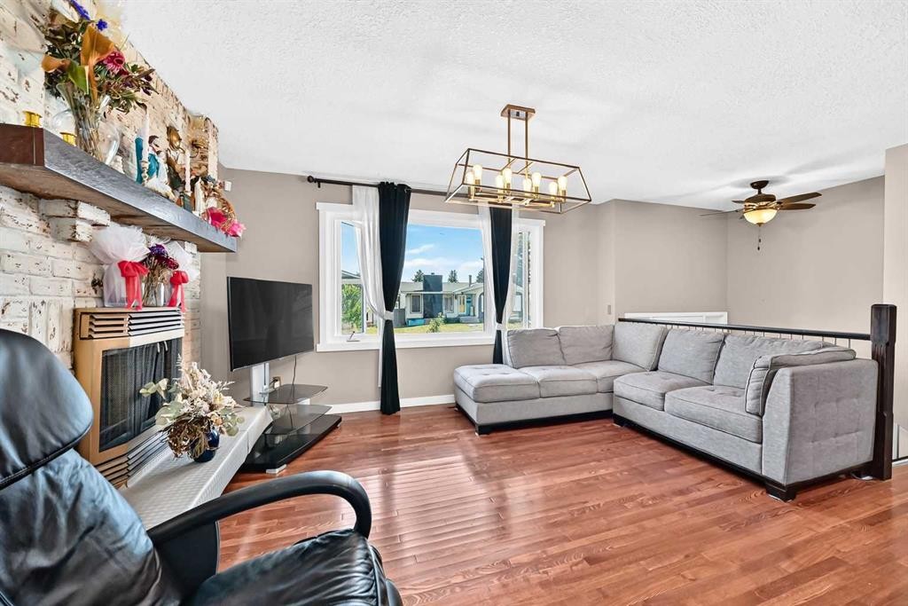 1823 65 Street Ne, Calgary, AB - Indoor Photo Showing Living Room With Fireplace