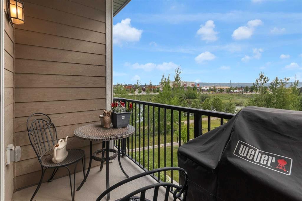 205-250 Fireside View, Cochrane, AB - Outdoor With Balcony With Exterior
