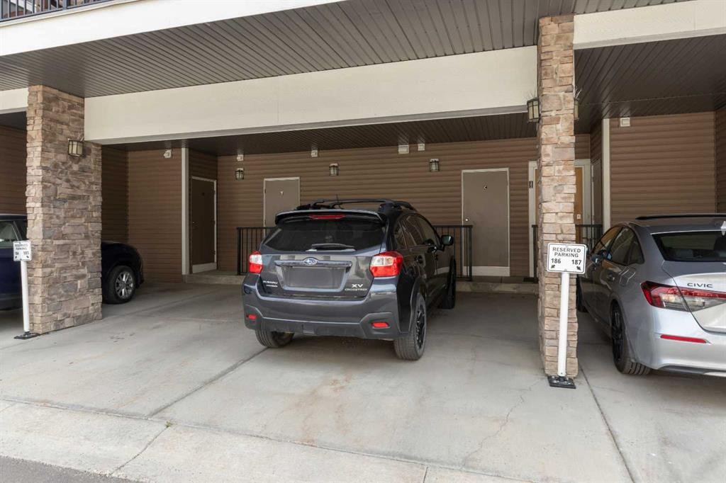 205-250 Fireside View, Cochrane, AB - Indoor Photo Showing Garage