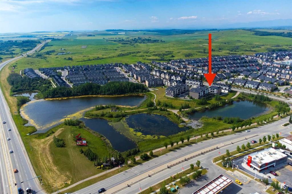 205-250 Fireside View, Cochrane, AB - Outdoor With Body Of Water With View