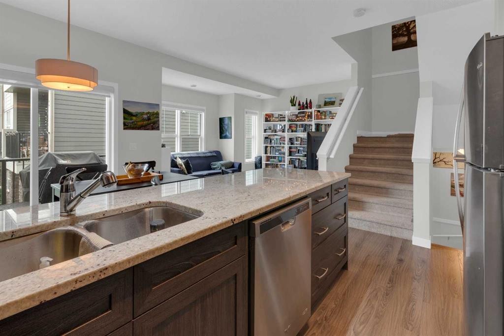 205-250 Fireside View, Cochrane, AB - Indoor Photo Showing Kitchen With Double Sink