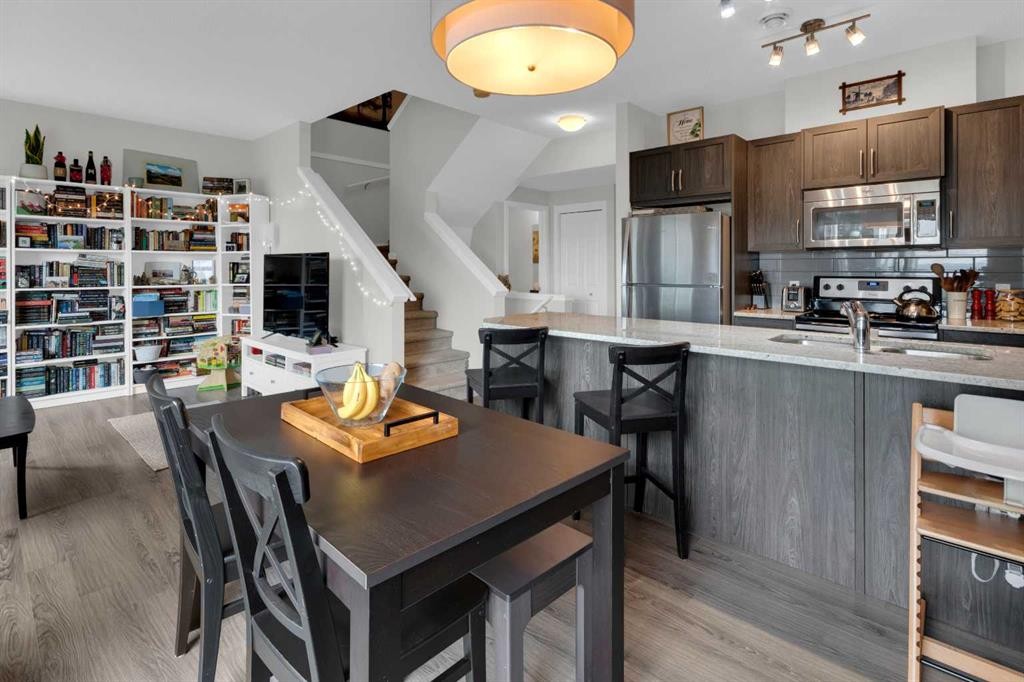 205-250 Fireside View, Cochrane, AB - Indoor Photo Showing Kitchen With Stainless Steel Kitchen