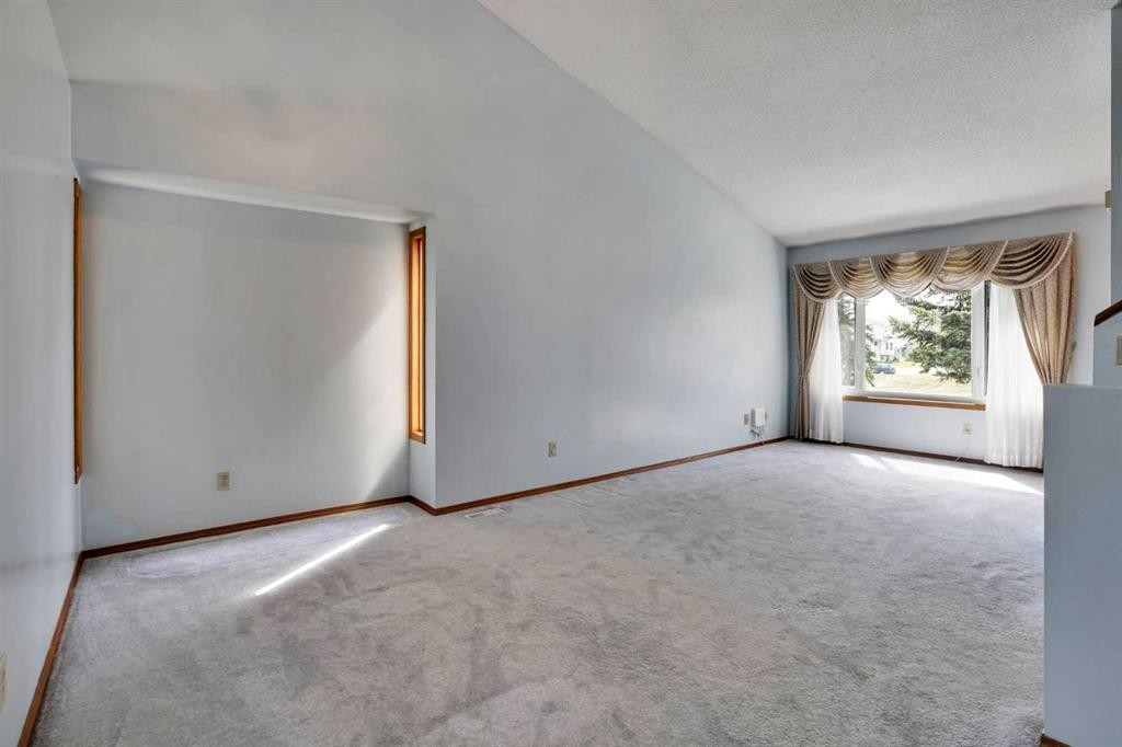21 La Valencia Green Ne, Calgary, AB - Indoor Photo Showing Other Room