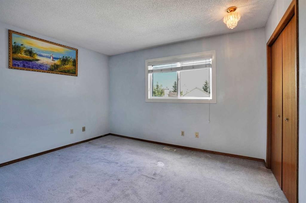21 La Valencia Green Ne, Calgary, AB - Indoor Photo Showing Other Room