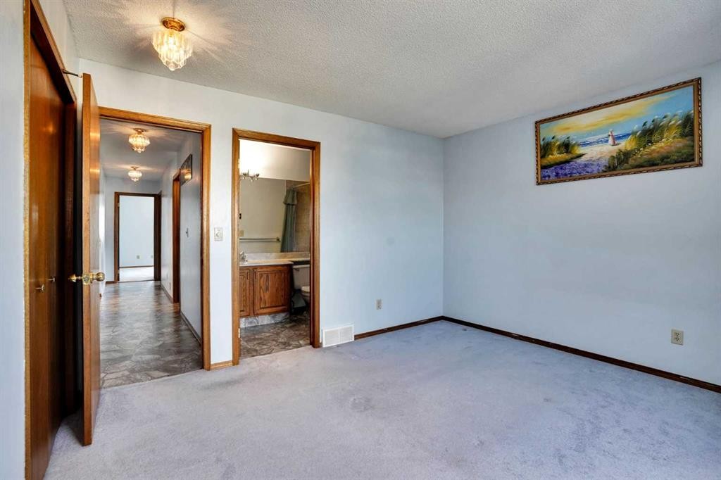 21 La Valencia Green Ne, Calgary, AB - Indoor Photo Showing Other Room