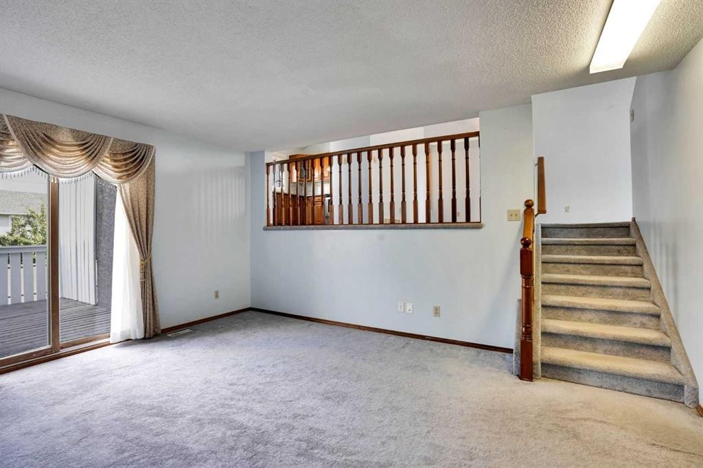 21 La Valencia Green Ne, Calgary, AB - Indoor Photo Showing Other Room