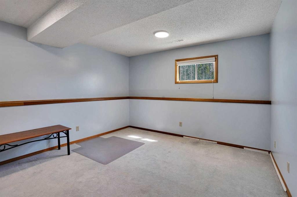 21 La Valencia Green Ne, Calgary, AB - Indoor Photo Showing Other Room
