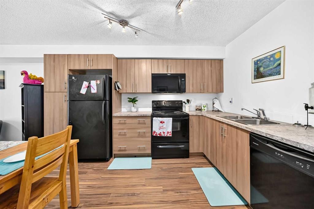 5102-755 Copperpond Boulevard Se, Calgary, AB - Indoor Photo Showing Kitchen With Double Sink