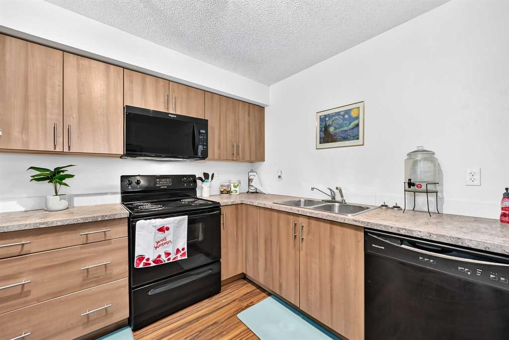 5102-755 Copperpond Boulevard Se, Calgary, AB - Indoor Photo Showing Kitchen With Double Sink
