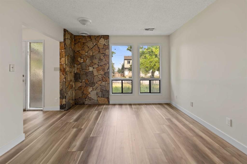 122 Berkley Way Nw, Calgary, AB - Indoor With Fireplace