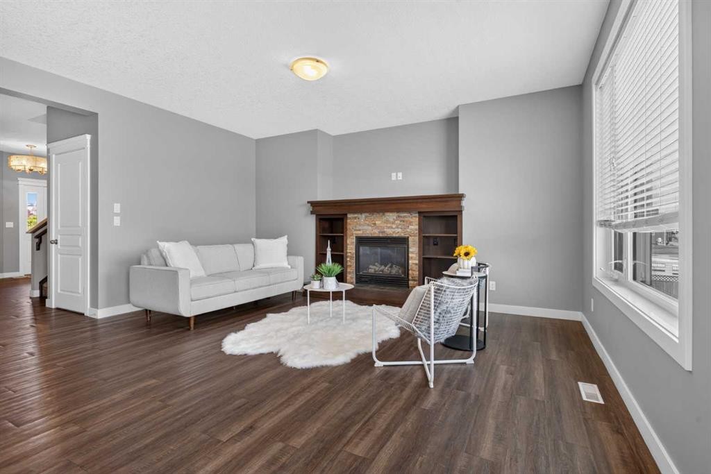47 Evanscrest Way Nw, Calgary, AB - Indoor Photo Showing Living Room With Fireplace