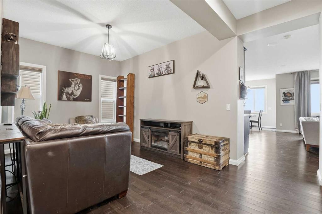 113 Sunset View, Cochrane, AB - Indoor With Fireplace