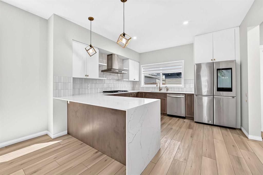 856 Midtown Drive Sw, Airdrie, AB - Indoor Photo Showing Kitchen With Stainless Steel Kitchen With Upgraded Kitchen