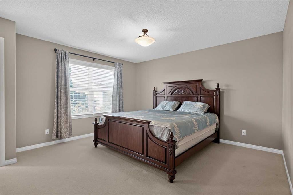 189 Bridleridge View Sw, Calgary, AB - Indoor Photo Showing Bedroom