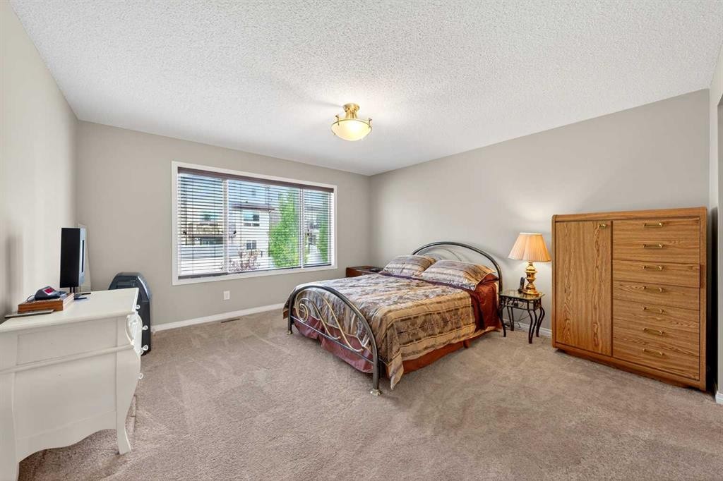 27 Panatella Row Nw, Calgary, AB - Indoor Photo Showing Bedroom