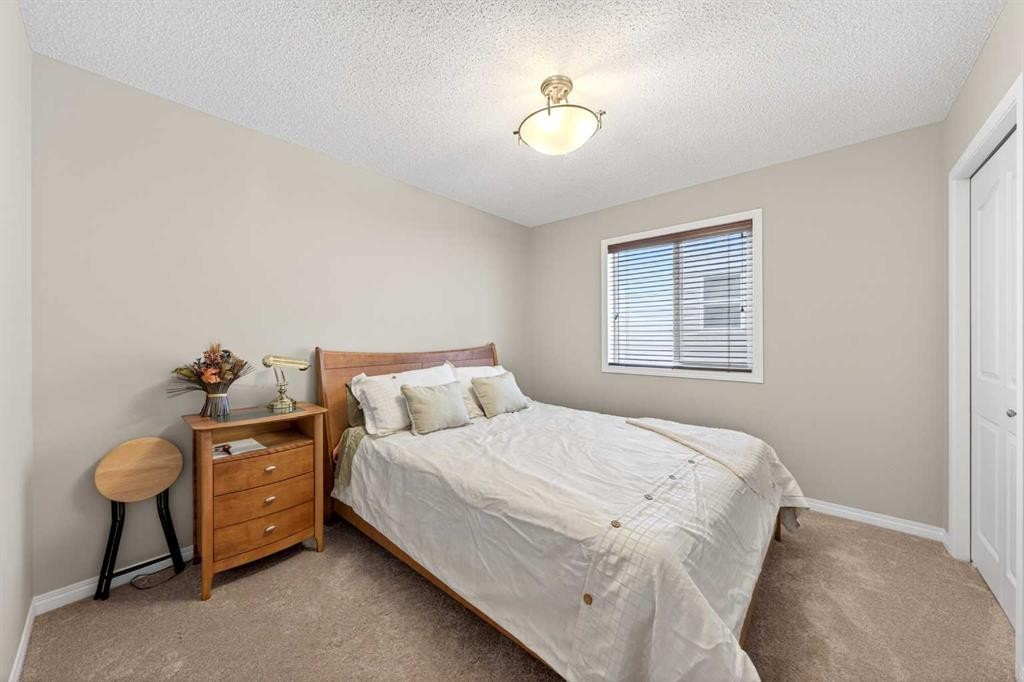 27 Panatella Row Nw, Calgary, AB - Indoor Photo Showing Bedroom