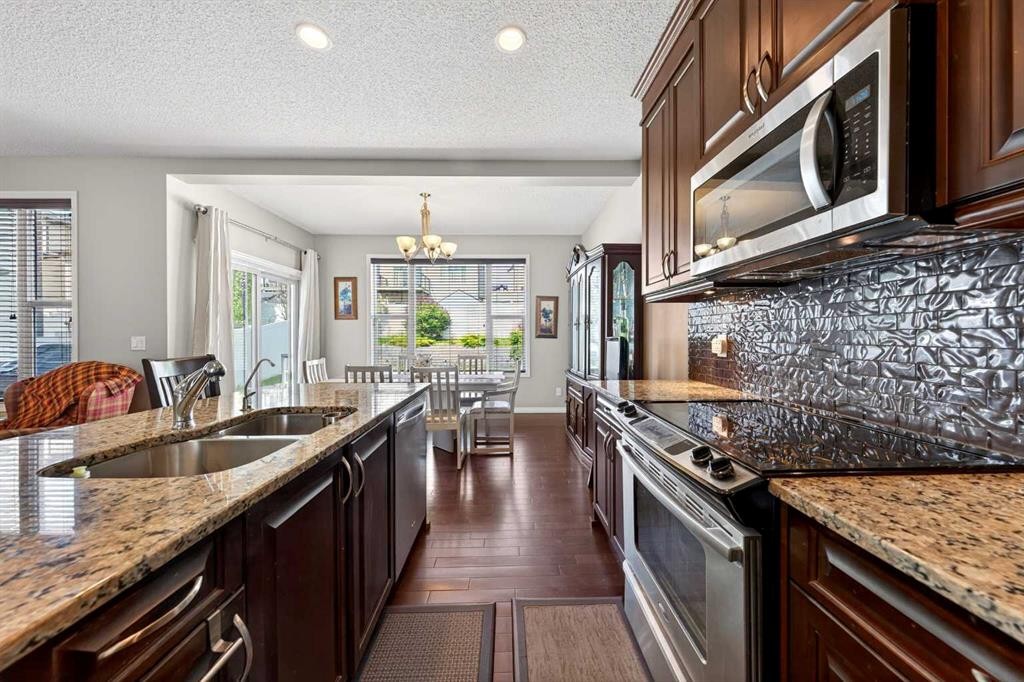 27 Panatella Row Nw, Calgary, AB - Indoor Photo Showing Kitchen With Double Sink With Upgraded Kitchen
