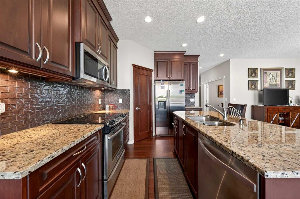 27 Panatella Row Nw, Calgary, AB - Indoor Photo Showing Kitchen With Stainless Steel Kitchen With Double Sink With Upgraded Kitchen