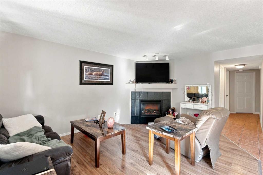 541 Citadel Meadow Bay Nw, Calgary, AB - Indoor Photo Showing Living Room With Fireplace