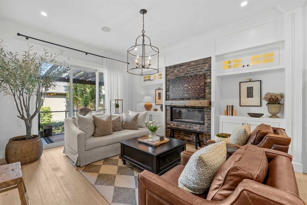 2012 49 Avenue Sw, Calgary, AB - Indoor Photo Showing Living Room With Fireplace