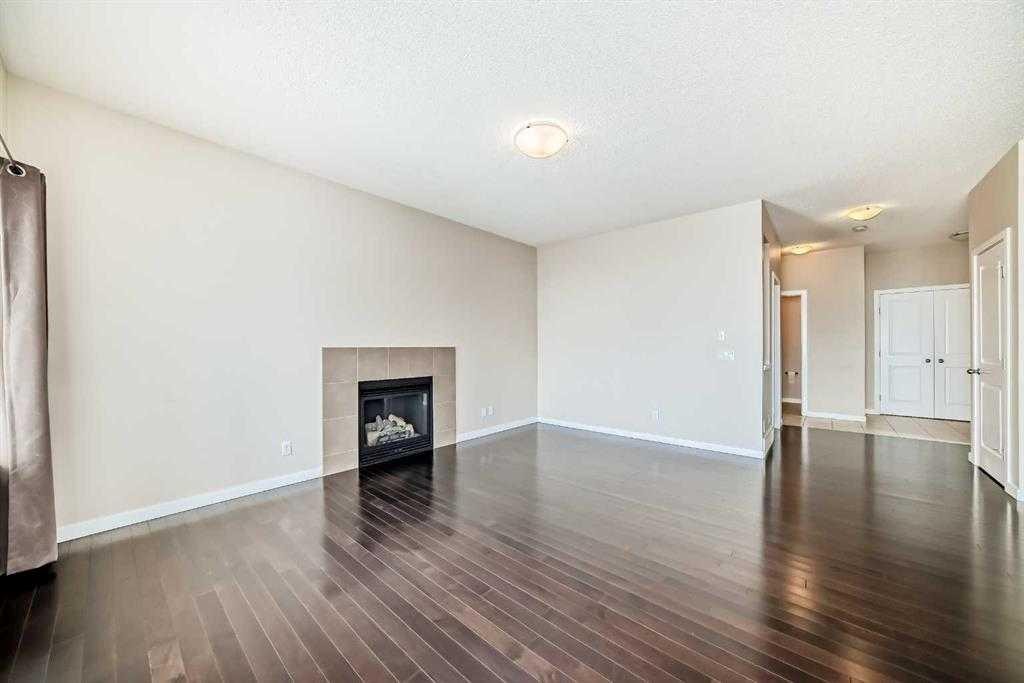 12 Kincora Mews Nw, Calgary, AB - Indoor Photo Showing Other Room With Fireplace