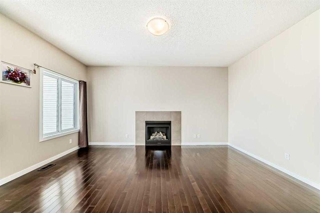 12 Kincora Mews Nw, Calgary, AB - Indoor Photo Showing Other Room With Fireplace