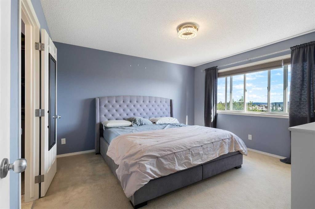 13 Tuscany Springs Circle Nw, Calgary, AB - Indoor Photo Showing Bedroom