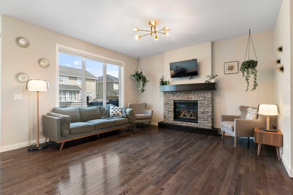 434 River Heights Drive, Cochrane, AB - Indoor Photo Showing Living Room With Fireplace