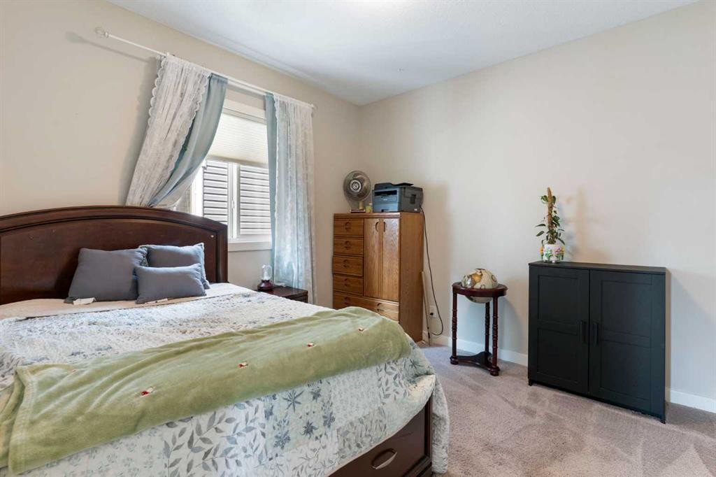 434 River Heights Drive, Cochrane, AB - Indoor Photo Showing Bedroom